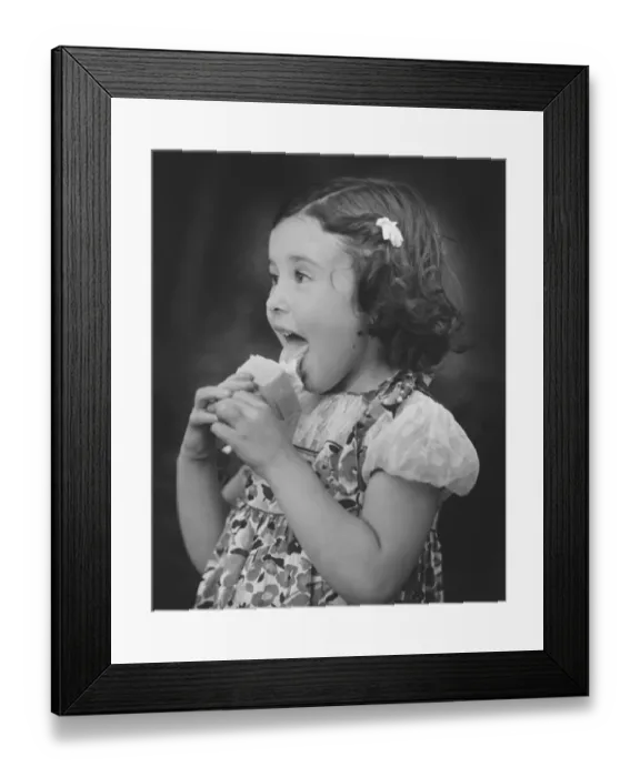 Framed Print : Girl (3-4) eating ice cream (B&W) Framed Print : Girl (3-4) eating ice cream (B&W)
