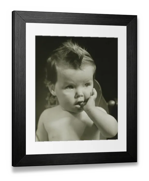 Framed Print : Baby boy (6-9 months) with thumb on mouth, (B&W), portrait Framed Print : Baby boy (6-9 months) with thumb on mouth, (B&W), portrait