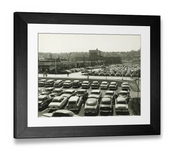 Framed Print : Cars parked on lot at shopping centre, elevated view (B&W) Framed Print : Cars parked on lot at shopping centre, elevated view (B&W)