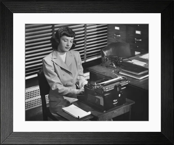 Framed Print : Secretary typing in office, (B&W) Framed Print : Secretary typing in office, (B&W)