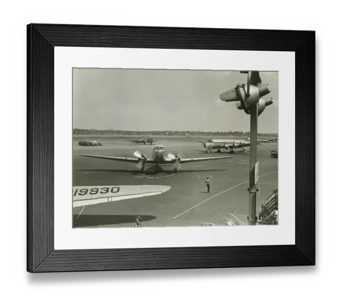 Framed Print : Planes on runway, (B&W), elevated view Framed Print : Planes on runway, (B&W), elevated view