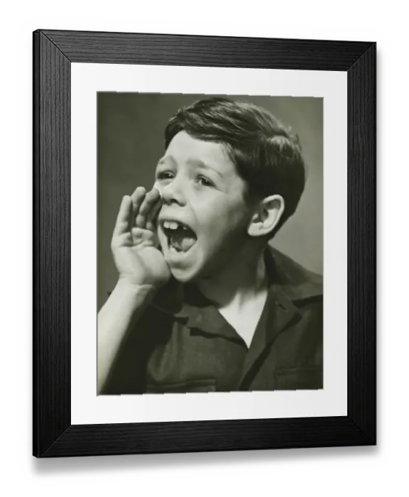 Framed Print : Boy (8-9) yelling in studio, (B&W), portrait Framed Print : Boy (8-9) yelling in studio, (B&W), portrait