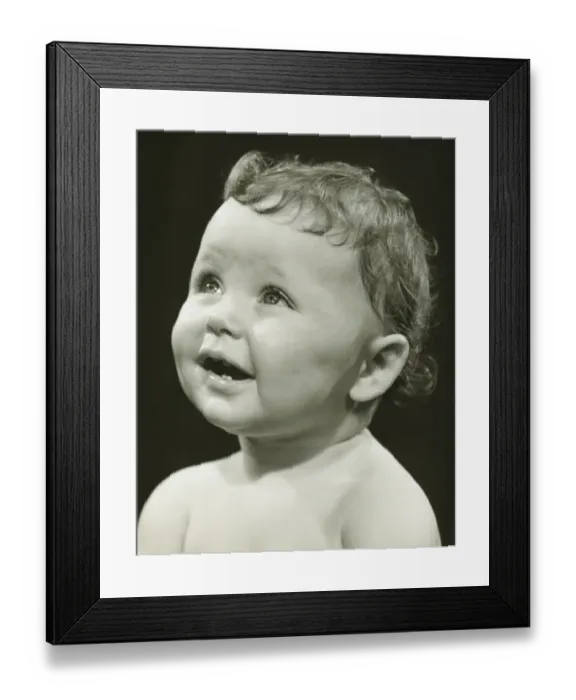 Framed Print : Baby boy (12-18 months) looking upwards, (B&W), close-up Framed Print : Baby boy (12-18 months) looking upwards, (B&W), close-up
