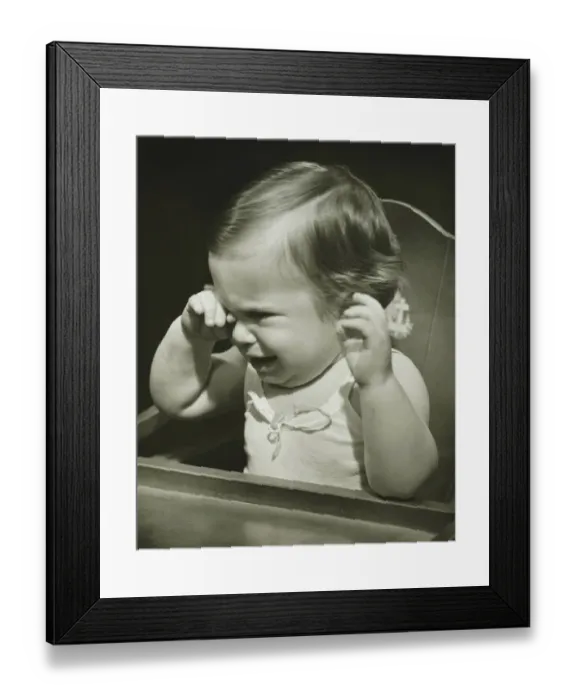 Framed Print : Baby girl (12-18 months) sitting in highchair, crying, (B&W), close-up Framed Print : Baby girl (12-18 months) sitting in highchair, crying, (B&W), close-up