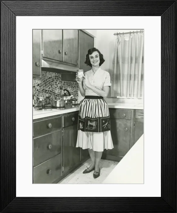 Framed Print : Woman posing in kitchen, (B&W), portrait Framed Print : Woman posing in kitchen, (B&W), portrait