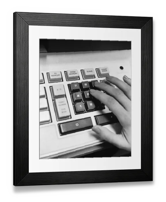 Framed Print : Hand using adding machine