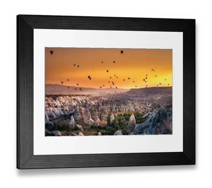 Framed Print : Hot air balloon flying over spectacular Cappadocia Framed Print : Hot air balloon flying over spectacular Cappadocia