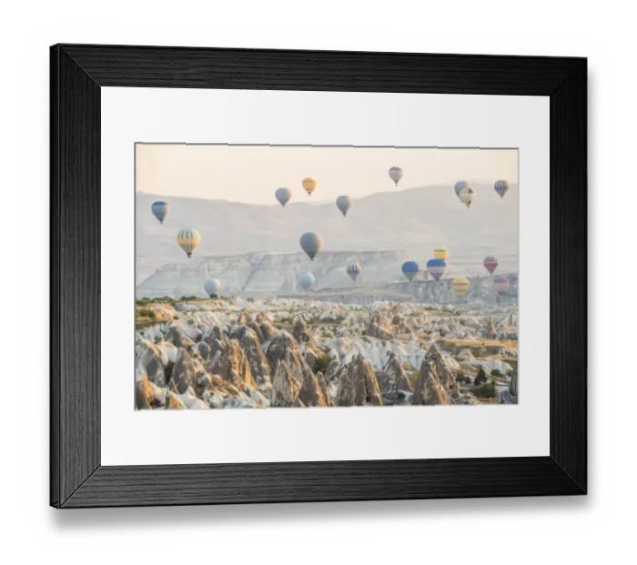 Framed Print : Hot air balloon flying over rock landscape at Cappadocia Turkey Framed Print : Hot air balloon flying over rock landscape at Cappadocia Turkey