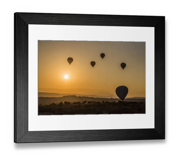 Framed Print : Hot air balloon flying over rock landscape at Cappadocia Turkey Framed Print : Hot air balloon flying over rock landscape at Cappadocia Turkey