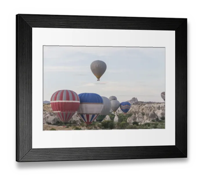 Framed Print : Hot air balloon flying over spectacular Cappadocia Framed Print : Hot air balloon flying over spectacular Cappadocia