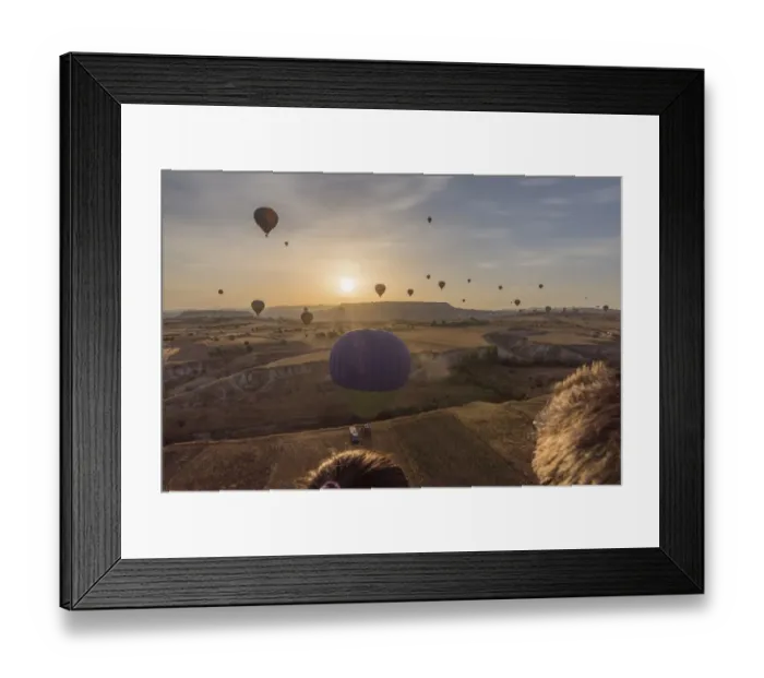 Framed Print : Hot air balloon flying over Cappadocia at morning