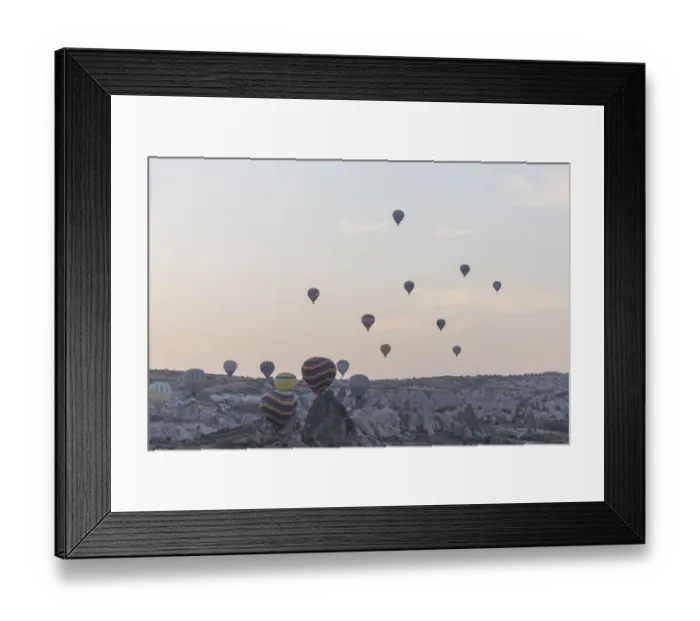 Framed Print : Hot air balloon flying over spectacular Cappadocia Framed Print : Hot air balloon flying over spectacular Cappadocia