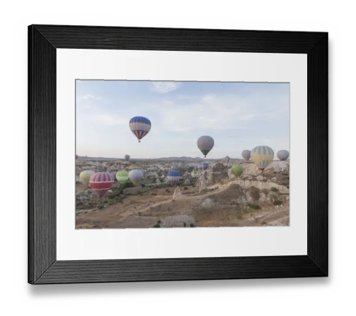 Framed Print : Hot air balloon flying over spectacular Cappadocia Framed Print : Hot air balloon flying over spectacular Cappadocia