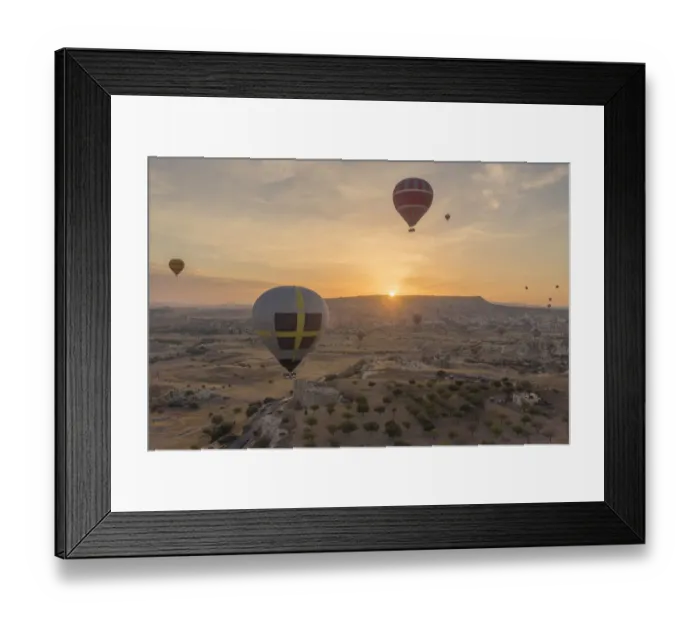 Framed Print : Hot air balloon flying over rock landscape at Cappadocia Turkey Framed Print : Hot air balloon flying over rock landscape at Cappadocia Turkey