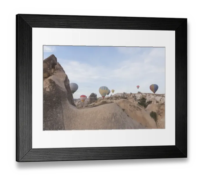 Framed Print : Hot air balloon flying over spectacular Cappadocia Framed Print : Hot air balloon flying over spectacular Cappadocia
