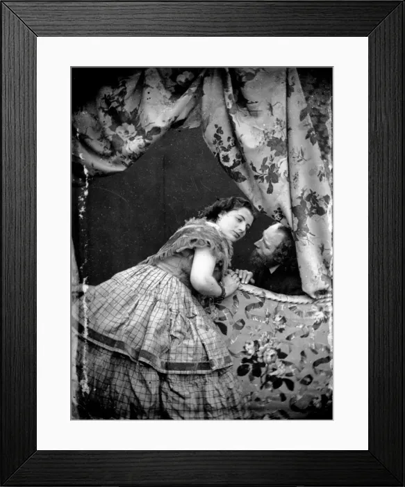 Framed Print : Bed Chat. circa 1865: A young woman leaning across the end of a bed to Framed Print : Bed Chat. circa 1865: A young woman leaning across the end of a bed to