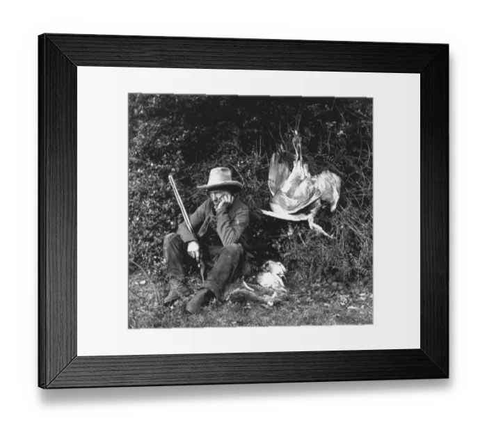 Framed Print : Pot Shot. circa 1857: A hunter with his catch of rabbits and birds