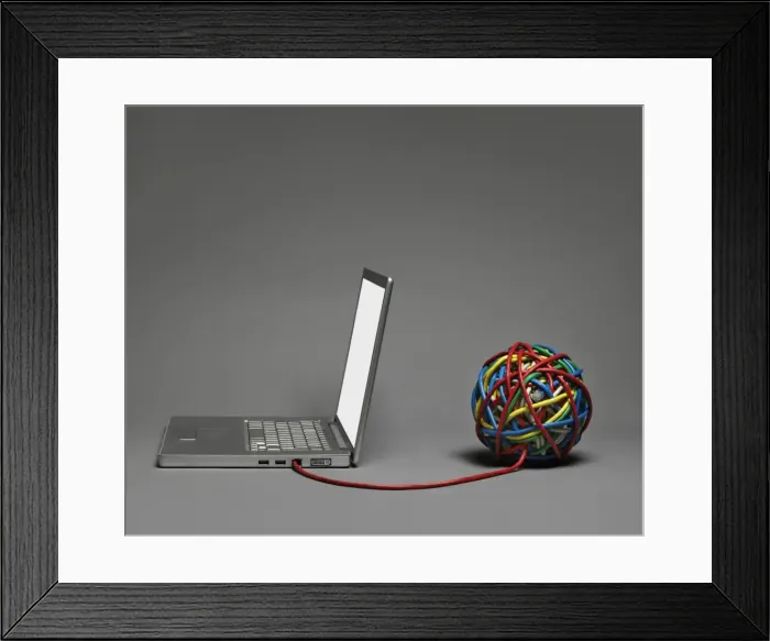 Framed Print : Laptop connected to cable ball Framed Print : Laptop connected to cable ball