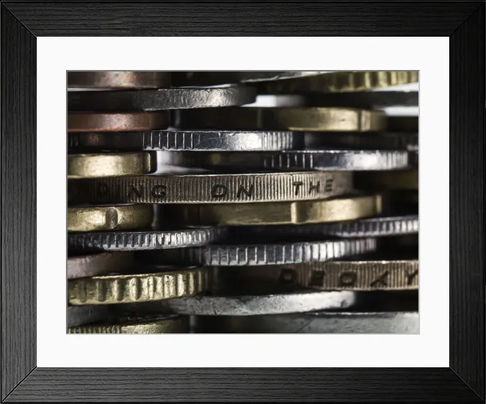 Framed Print : Coins stacked to form a wall Framed Print : Coins stacked to form a wall
