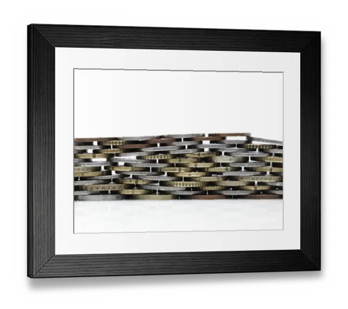 Framed Print : Coins stacked to form a wall Framed Print : Coins stacked to form a wall