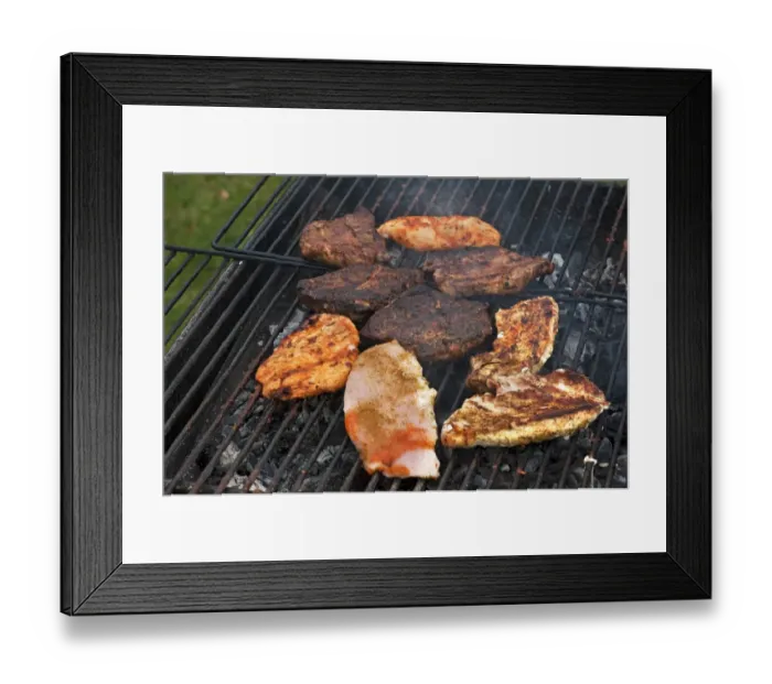 Framed Print : Heavily roasted meat on a charcoal grill Framed Print : Heavily roasted meat on a charcoal grill