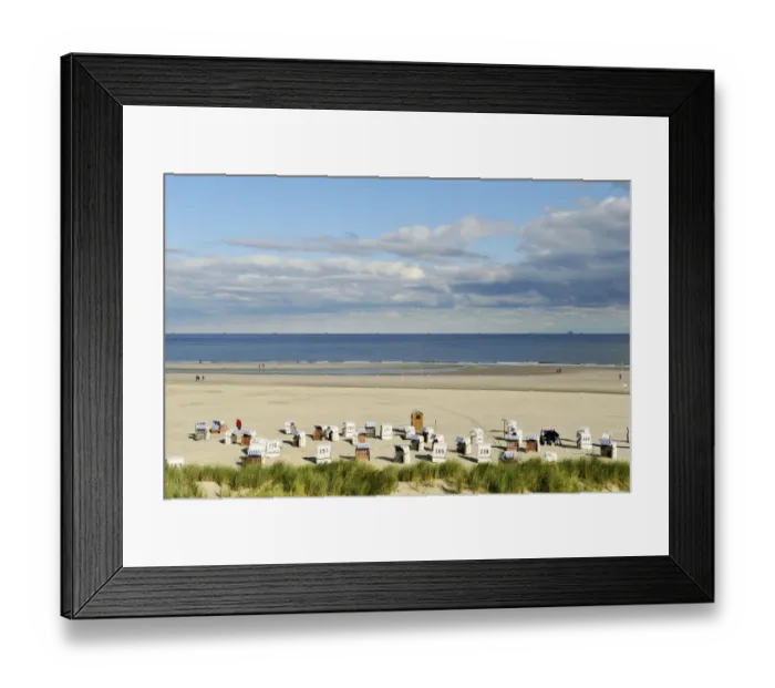 Framed Print : Beach with chair beach, North Sea with a cloudy sky, Spiekeroog, East Frisia, Lower Saxony, Germany Framed Print : Beach with chair beach, North Sea with a cloudy sky, Spiekeroog, East Frisia, Lower Saxony, Germany
