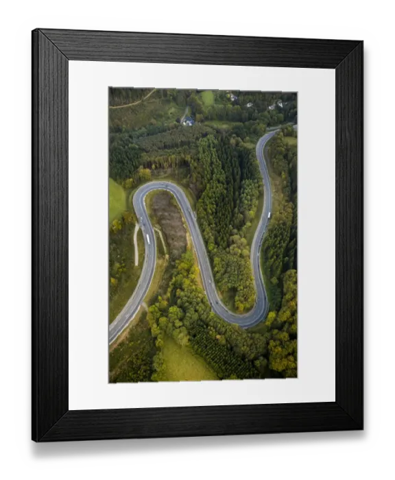 Framed Print : Aerial view, hairpin curves, winding road in the Sauerland forests, between Herscheid and Halver, North Rhine-Westphalia, Germany Framed Print : Aerial view, hairpin curves, winding road in the Sauerland forests, between Herscheid and Halver, North Rhine-Westphalia, Germany