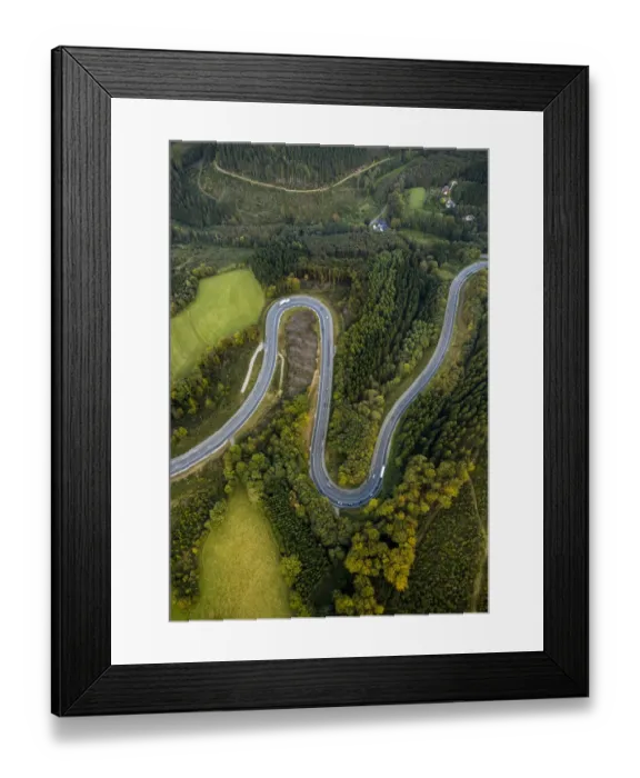 Framed Print : Aerial view, hairpin curves, winding road in the Sauerland forests, between Herscheid and Halver, North Rhine-Westphalia, Germany Framed Print : Aerial view, hairpin curves, winding road in the Sauerland forests, between Herscheid and Halver, North Rhine-Westphalia, Germany