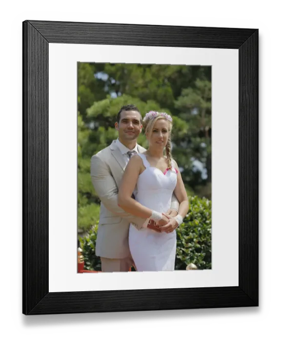 Framed Print : Bride and groom posing in a park Framed Print : Bride and groom posing in a park