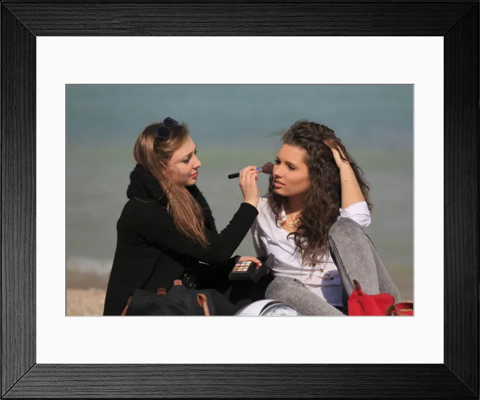 Framed Print : Two girlfriends, teenagers, sitting on the beach, applying makeup on each other, Menton, Alpes-Maritimes, Provence Alpes, France Framed Print : Two girlfriends, teenagers, sitting on the beach, applying makeup on each other, Menton, Alpes-Maritimes, Provence Alpes, France