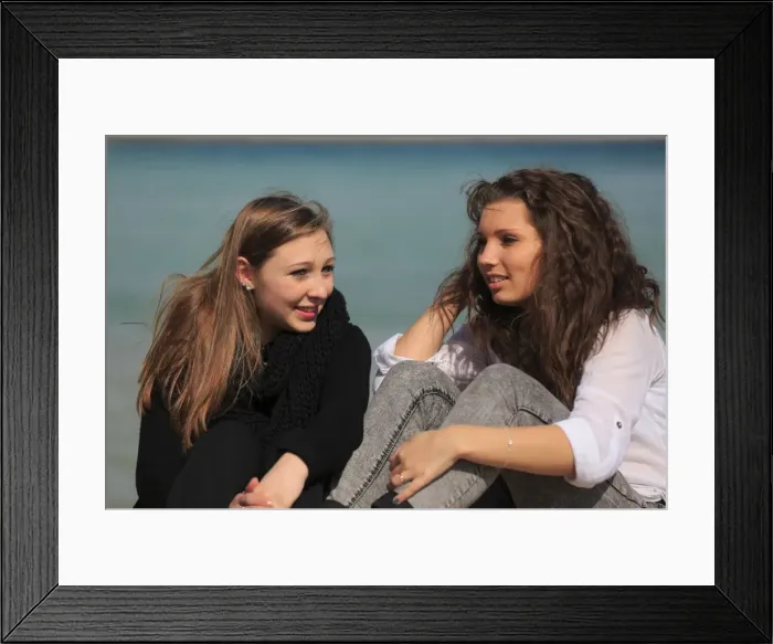 Framed Print : Two girlfriends, teenagers sitting on the beach, Menton, Alpes-Maritimes, Provence Alpes, France Framed Print : Two girlfriends, teenagers sitting on the beach, Menton, Alpes-Maritimes, Provence Alpes, France