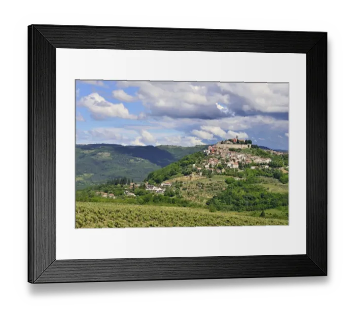 Framed Print : View across vineyards to the town with atmospheric clouds, Motovun, Montona, Mirna Valley, Istria, Croatia Framed Print : View across vineyards to the town with atmospheric clouds, Motovun, Montona, Mirna Valley, Istria, Croatia