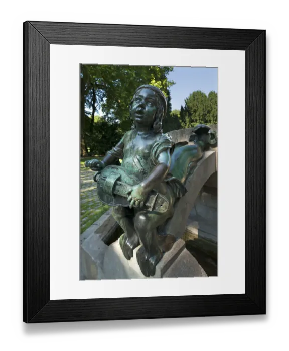 Framed Print : Childs sculpture with musical instrument and fish fin on Minnesangerbrunnen fountain, art nouveau, 1905, Rosenaupark, Nuremberg, Middle Franconia, Bavaria, Germany Framed Print : Childs sculpture with musical instrument and fish fin on Minnesangerbrunnen fountain, art nouveau, 1905, Rosenaupark, Nuremberg, Middle Franconia, Bavaria, Germany