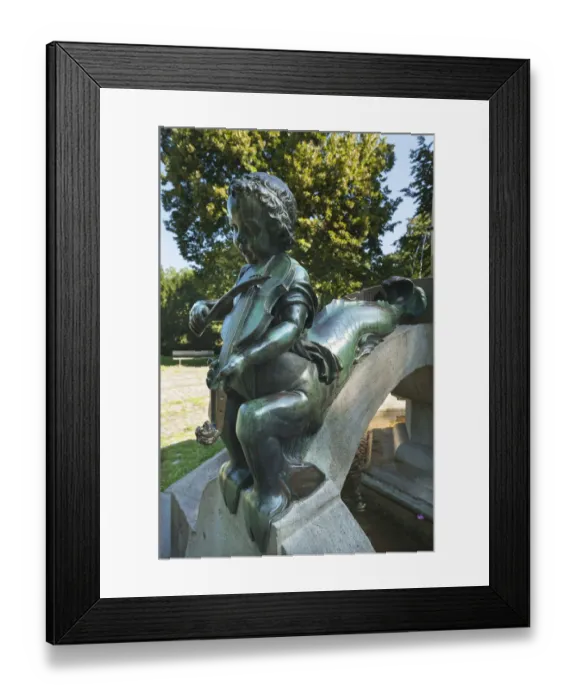 Framed Print : Childs sculpture with musical instrument and fish fin on Minnesangerbrunnen fountain, art nouveau, 1905, Rosenaupark, Nuremberg, Middle Franconia, Bavaria, Germany