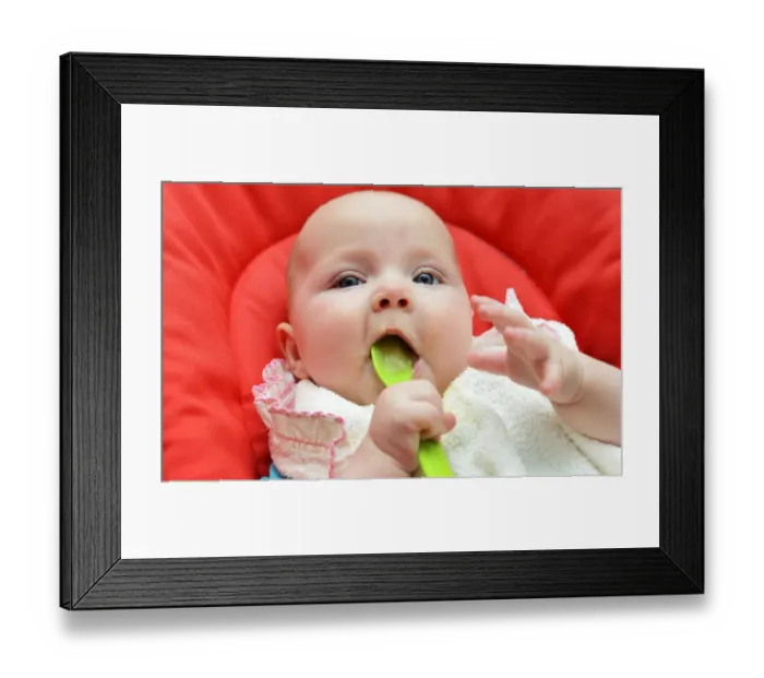 Framed Print : Baby, girl, six months, fed with baby food, Germany Framed Print : Baby, girl, six months, fed with baby food, Germany