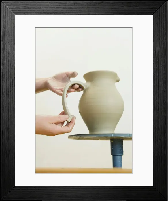 Framed Print : Ceramic artist working in her workshop, pulling a handle for a pitcher, Geisenhausen, Bavaria, Germany, Europe Framed Print : Ceramic artist working in her workshop, pulling a handle for a pitcher, Geisenhausen, Bavaria, Germany, Europe