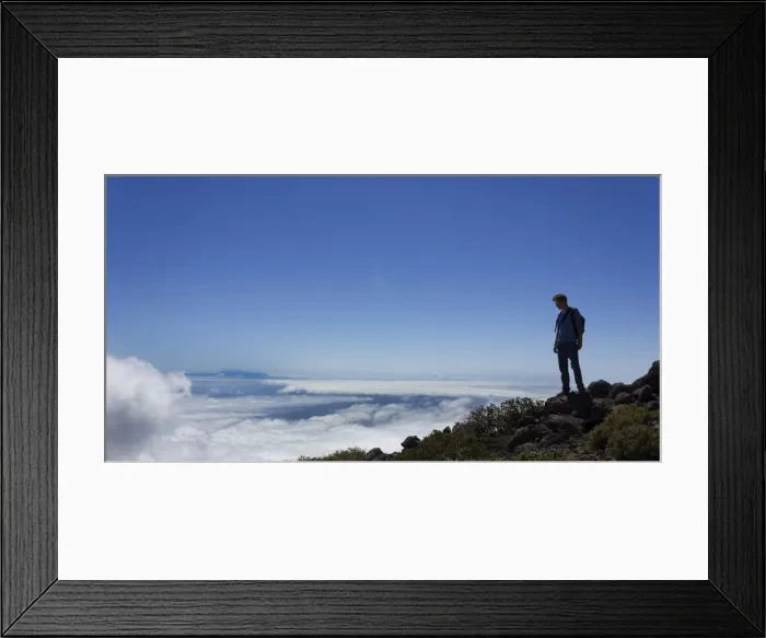 Framed Print : Young man looking across a layer of clouds, La Palma, Canary Islands, Spain Framed Print : Young man looking across a layer of clouds, La Palma, Canary Islands, Spain