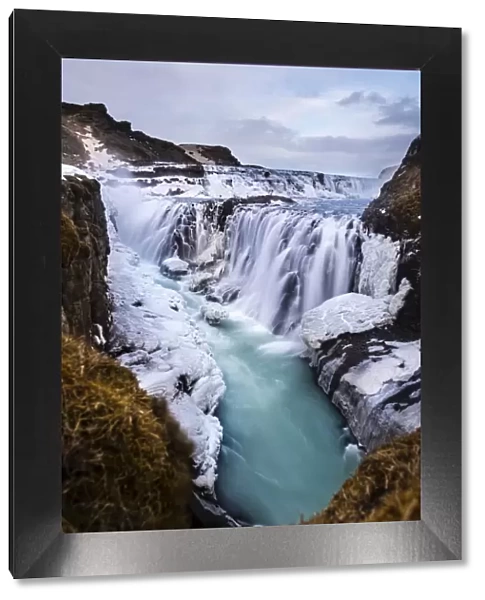 Gullfoss waterfall, with ice and stones, Vik, Iceland