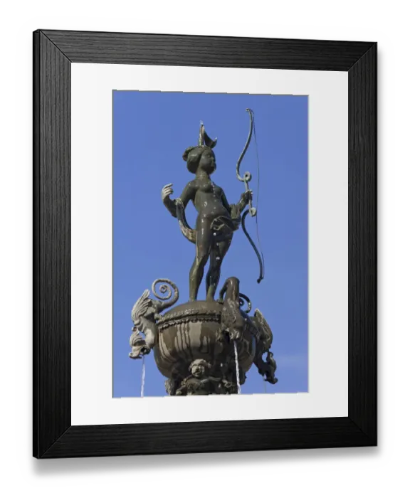 Framed Print : Luna sculpture on the Luna Fountain, 1530, against blue sky, market square, Luneburg, Lower Saxony, Germany Framed Print : Luna sculpture on the Luna Fountain, 1530, against blue sky, market square, Luneburg, Lower Saxony, Germany