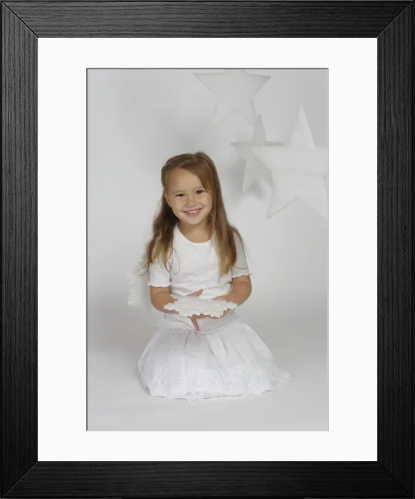 Framed Print : Child, girl wearing an angel costume with stars, Christmas, festive season Framed Print : Child, girl wearing an angel costume with stars, Christmas, festive season