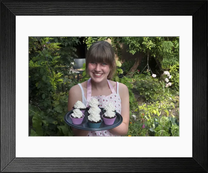 Framed Print : Girl presenting her homemade Oreo brownie cupcakes Framed Print : Girl presenting her homemade Oreo brownie cupcakes