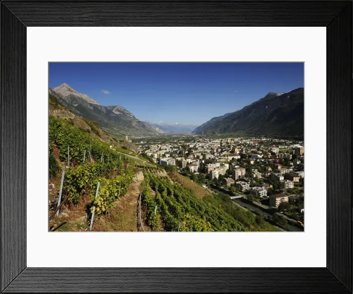 Framed Print : The town of Martigny, surrounded by vineyards, Martigny, Canton of Valais, Switzerland Framed Print : The town of Martigny, surrounded by vineyards, Martigny, Canton of Valais, Switzerland