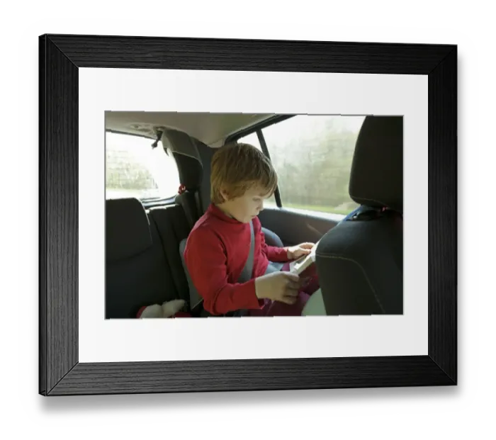 Framed Print : Boy reading in the car Framed Print : Boy reading in the car
