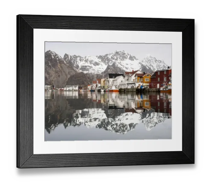 Framed Print : The Lofoten mountains being reflected in the water of the harbour of Henningsvaer, Lofoten, Norway