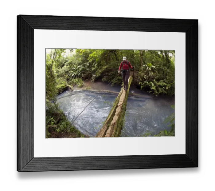 Framed Print : Hiker crossing the Rio Celeste on a wooden bridge, Tenorio National Park, Guanacaste, Costa Rica, Central America Framed Print : Hiker crossing the Rio Celeste on a wooden bridge, Tenorio National Park, Guanacaste, Costa Rica, Central America