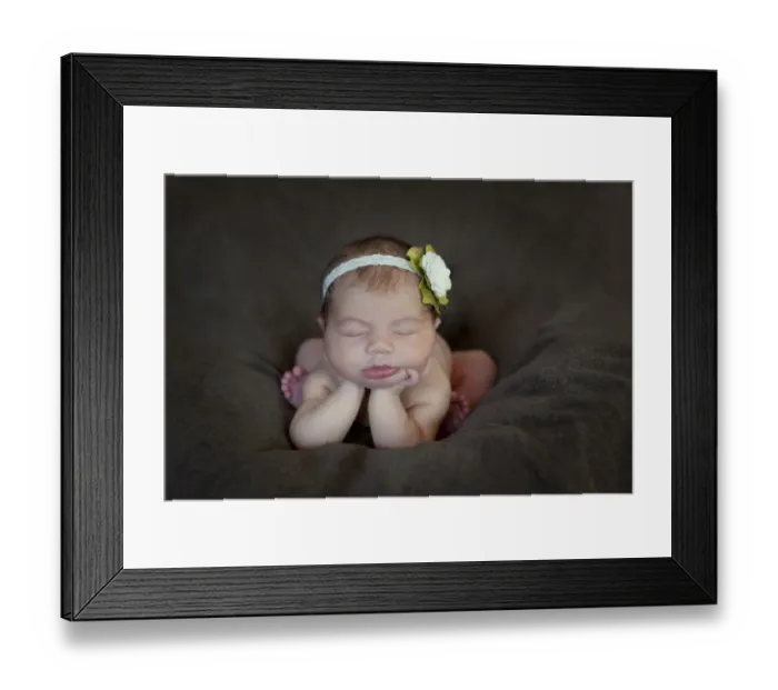 Framed Print : Newborn baby, five days, asleep with head propped up on hands Framed Print : Newborn baby, five days, asleep with head propped up on hands