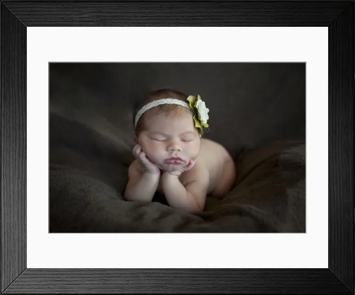 Framed Print : Newborn baby, five days, asleep with head propped up on hands Framed Print : Newborn baby, five days, asleep with head propped up on hands