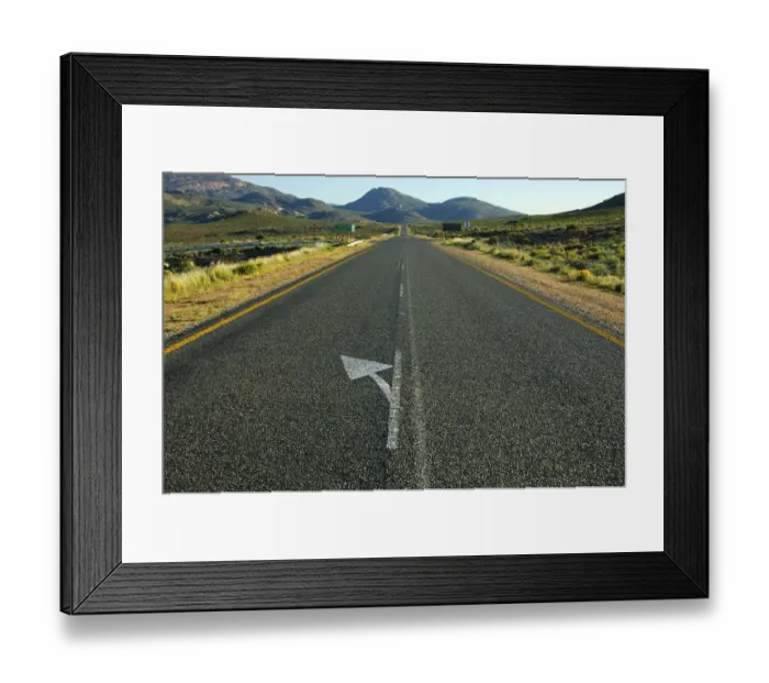 Framed Print : Directional arrow to the left on the straight strip of asphalt at the National Road N7 near Springbok on the road north to the border with Namibia, Northern Cape Province, South Africa, Africa Framed Print : Directional arrow to the left on the straight strip of asphalt at the National Road N7 near Springbok on the road north to the border with Namibia, Northern Cape Province, South Africa, Africa