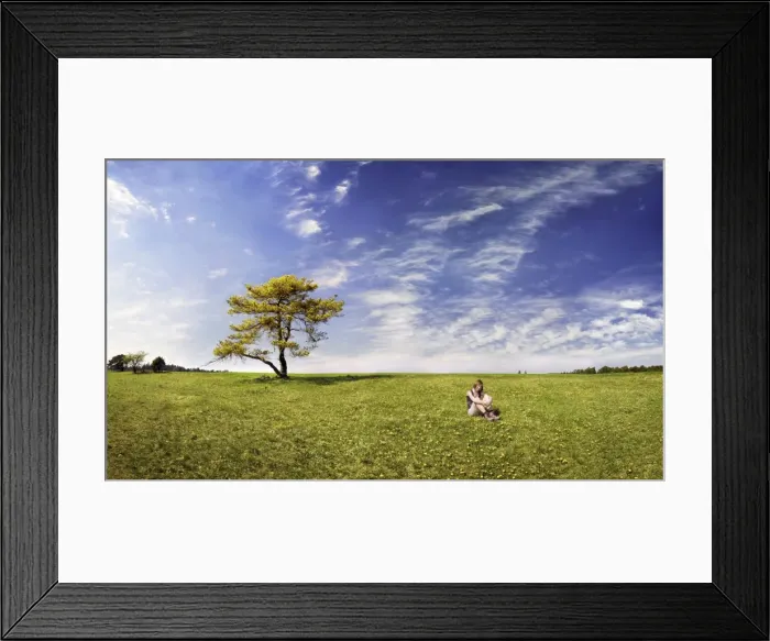 Framed Print : Girl sitting in a meadow with pine tree, Altmuehltal Nature Park near Titting, Bavaria, Germany, Europe Framed Print : Girl sitting in a meadow with pine tree, Altmuehltal Nature Park near Titting, Bavaria, Germany, Europe