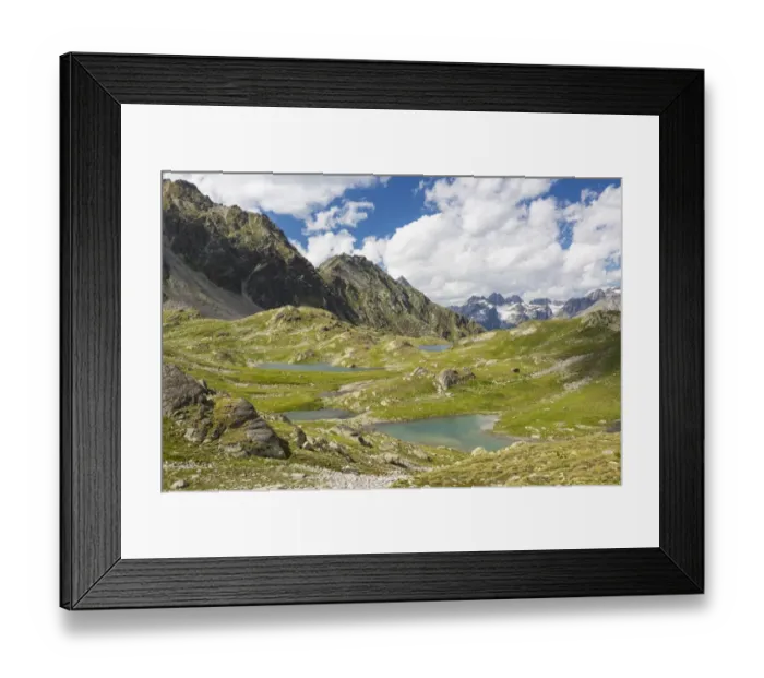 Framed Print : Macun plateau of lakes with views of the Verstancla group with the mountains Chaputschin and Verstanclahorn, Swiss National Park, Graubunden or Grisons, Switzerland Framed Print : Macun plateau of lakes with views of the Verstancla group with the mountains Chaputschin and Verstanclahorn, Swiss National Park, Graubunden or Grisons, Switzerland